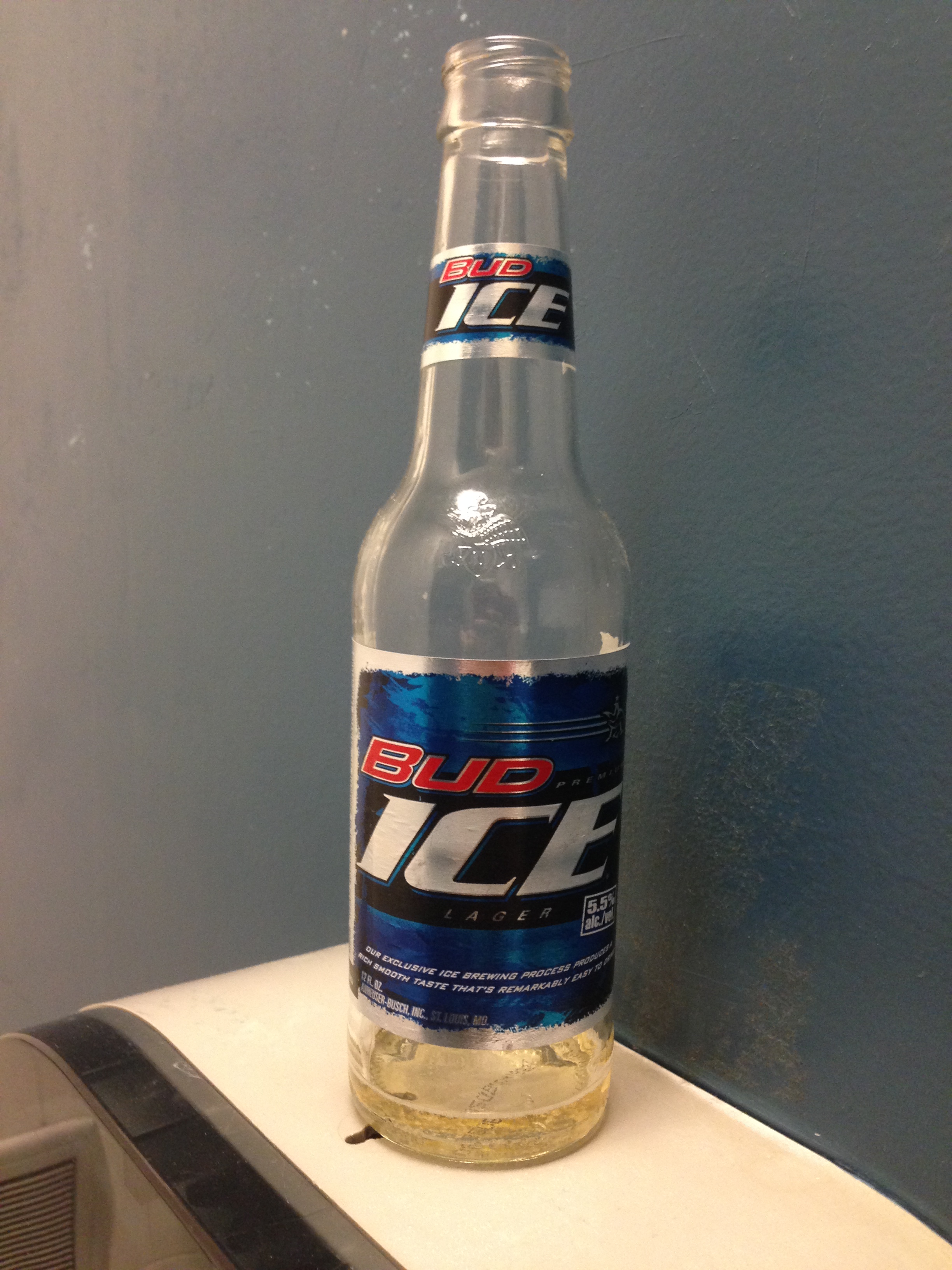 Unfinished Beer in the Bathroom Stall
